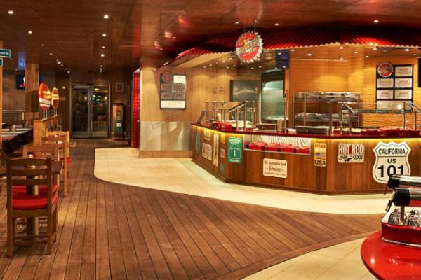 Carnival teamed up with best-selling author, restaurateur and Food Network personality Guy Fieri to bring all the authentic appeal of a roadside burger shack to Guy's Burger Joint, a cool poolside spot for hot burgers and hand-cut fries.