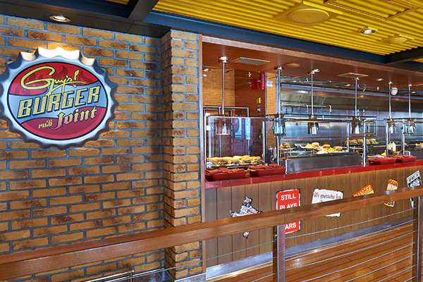Guy's Burger Joint aboard Carnival Festivale channels a coastal roadside shack, serving Guy Fieri–crafted burgers and fries—order a signature stack or go off-road at the toppings bar to make it your own.
Cost: Included