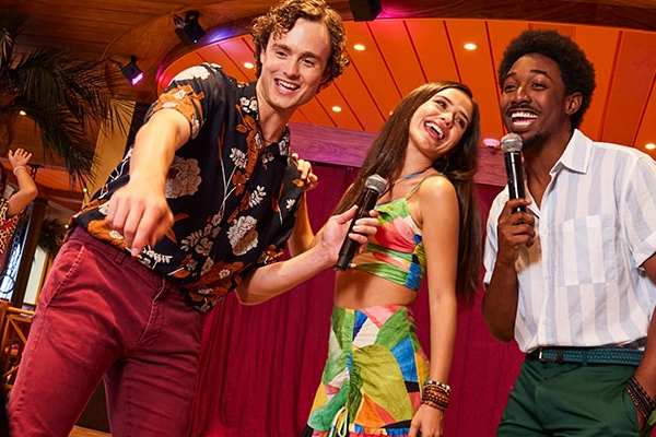 Unleash your inner star with live karaoke across the ship—grab the mic, choose from a huge catalog of classics and current hits, and step into the spotlight any night of your cruise. From ’80s anthems to Motown and boy-band bangers, the stage is yours.
Cost: Included
