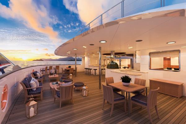 A shaded space designed for breezy relaxation and mingling. Unwind with a choice beverage in hand as enchanting seascapes drift by — laid-back elegance at its finest.