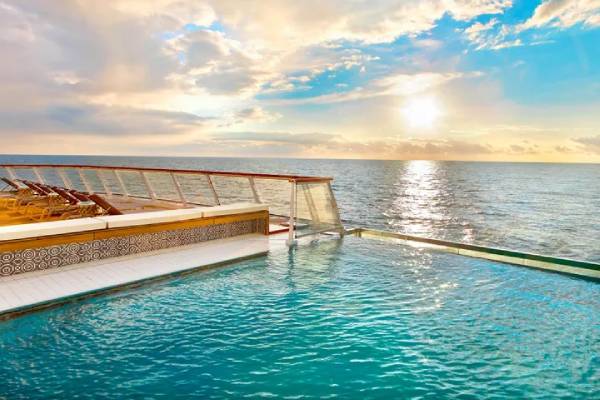 The Infinity Pool, one of the first of its kind at sea, gives you a sense of swimming in the heart of your destination. Its glass backing is infused with the spirit of exploration.