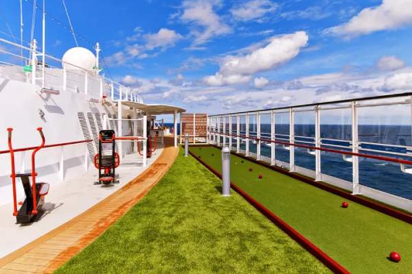 Spectacular views and fresh air meet activities on the Sports Deck. Here you will find a walking track; an array of games, bocce ball, golf putting green and shuffleboard. Practice your own stretching and yoga outdoors, or relax with plentiful seating.