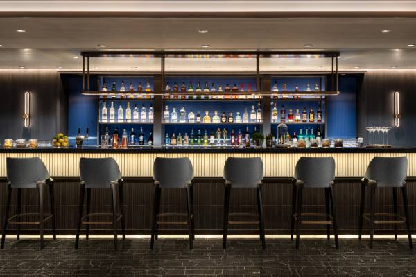 This chic, comfortable gathering place transforms from a library and coffee bar by day to a cocktail lounge at night.