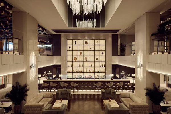 A central gathering bar and lounge, set among the ship's high-end boutiques, provides the ideal spot to enjoy refreshments day and night.